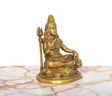 Brass Lord Shiva statue, trident upright, blessing gesture, seated on ornate round base, 6.5-inch.