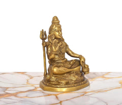 Brass Lord Shiva statue, trident upright, blessing gesture, seated on ornate round base, 6.5-inch.
