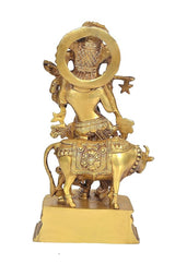 Back view of brass Lord Krishna figurine on pedestal, circular halo and decorative arms