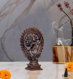 Copper Natraja dancing Shiva idol figurine, side view with extended arms