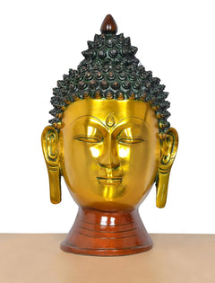 Brass Buddha head wall hanging, gold face with ornate dark crown and side ear details