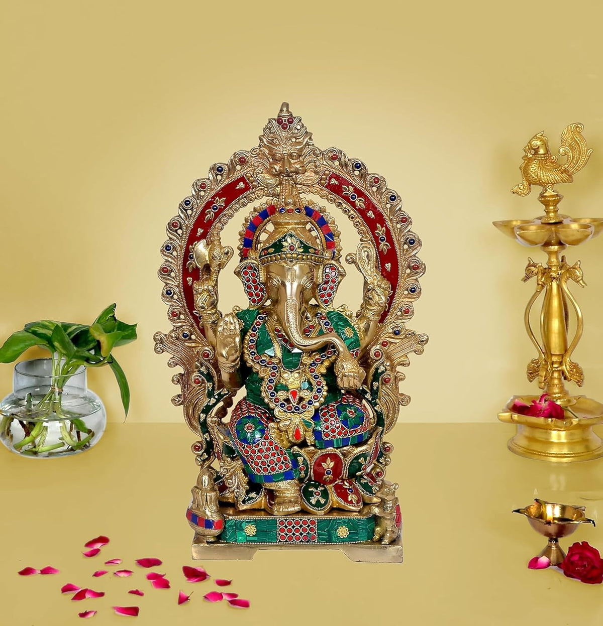 Brass Ganesha statue with Kirtimuka frame, seated on lotus base, multicolor details