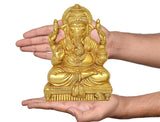 Brass Ganesha wall hanging idol held in hands for size, seated with raised fingers