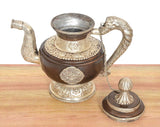 Himalayan brass teapot with open mouth, engraved body panels, ornate base pedestal