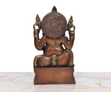 Ganesha brass idol, rear view with carved circular halo and gold accents