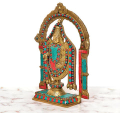 Brass Tirupati Balaji idol from side, arched canopy with red and turquoise panels