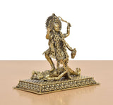 Mahakaali idol angled view, sculpted brass jewelry, ornate pedestal base
