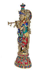 Krishna brass sculpture side view, jeweled teal and red garments with ornate crown