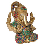 Close-up Ganesha statue angle, gold brass face with colorful studded armor
