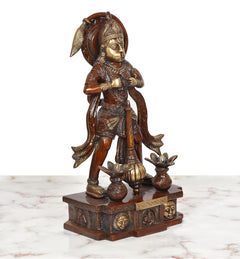 Brass Hanuman idol angled front view, ornate crown, holding small pots, carved base