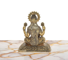 Superfine brass Ganesh statue, back view with crown-like headpiece and seated base