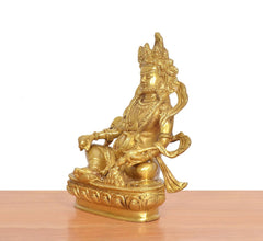 Golden Kuber Bhagwan brass murti, side view, seated pose with decorative ornaments