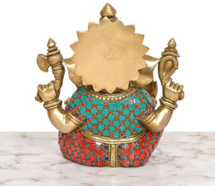 Brass Ganpati Bappa murti back view, gold-toned back panel with multicolor waist jewels