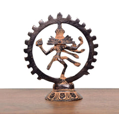 Brass Natraj dancing sculpture with dark gear-like circular ring and round pedestal