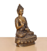 Brass seated Buddha idol showing Abhaya mudra hand, detailed lower base and legs