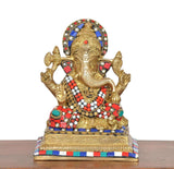 Brass Lord Ganesha idol, front view; colorful gem accents on crown, ornaments, and seat base