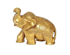 Brass elephant decorative statue, side profile with decorative carved patterns