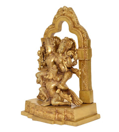 Side view of brass Lakshmi-Narayana on Garuda statue with carved arch and base