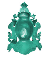 Green resin back view of Tara wall mask statue with hanging loop and textured surface