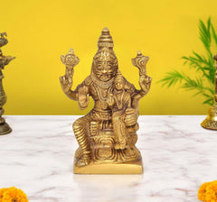 Brass Lakshmi-Narasimha idol with four arms raised, seated on pedestal