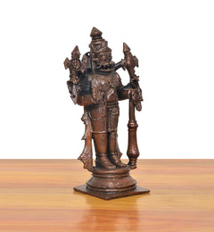 Left-side copper Lord Narasimha standing idol, four arms holding weapons