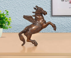 Brass flying horse with wings, gold-brown decorative figurine with relief details