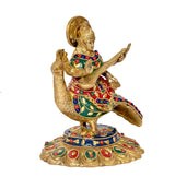 Brass Saraswati on swan veena idol, rear-side angle, colorful jeweled dress and base.