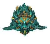 Teal Kirtimukha resin wall ornament with gold headdress, layered brows and fangs