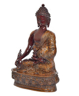 Meditating Buddha statue side view, raised hand gesture, dark red and gold robe detailing