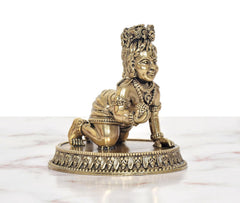 AONA bronze Bal Gopal Krishna murti, kneeling figure holding a rounded pot at hip