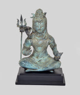 Vintage bronze Shiva statue, turquoise patina, seated with one hand raised and trident beside