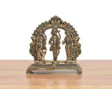 Brass ram darbar figurine set on ornate carved frame base with three standing deities