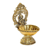 Gold brass Ganesh diya oil lamp, detailed deity in arch above shallow bowl