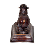 Nandi bull idol in dark bronze brass, patterned pedestal base, front view