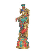 Krishna brass sculpture side view, multicolor jewels on armor, ornate gold detailing
