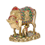 Brass cow with calf decor statue, detailed ornaments on cloth and neck, gold base