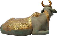 Brass Nandi sculpture, side view with engraved body and gold saddle pattern