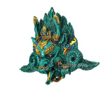 Teal resin Kirtimukha wall charm with gold forehead mark, scales and outstretched arms