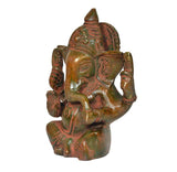 Brass Ganesha idol statue, side view with detailed trunk, draped hands and painted ornamentation