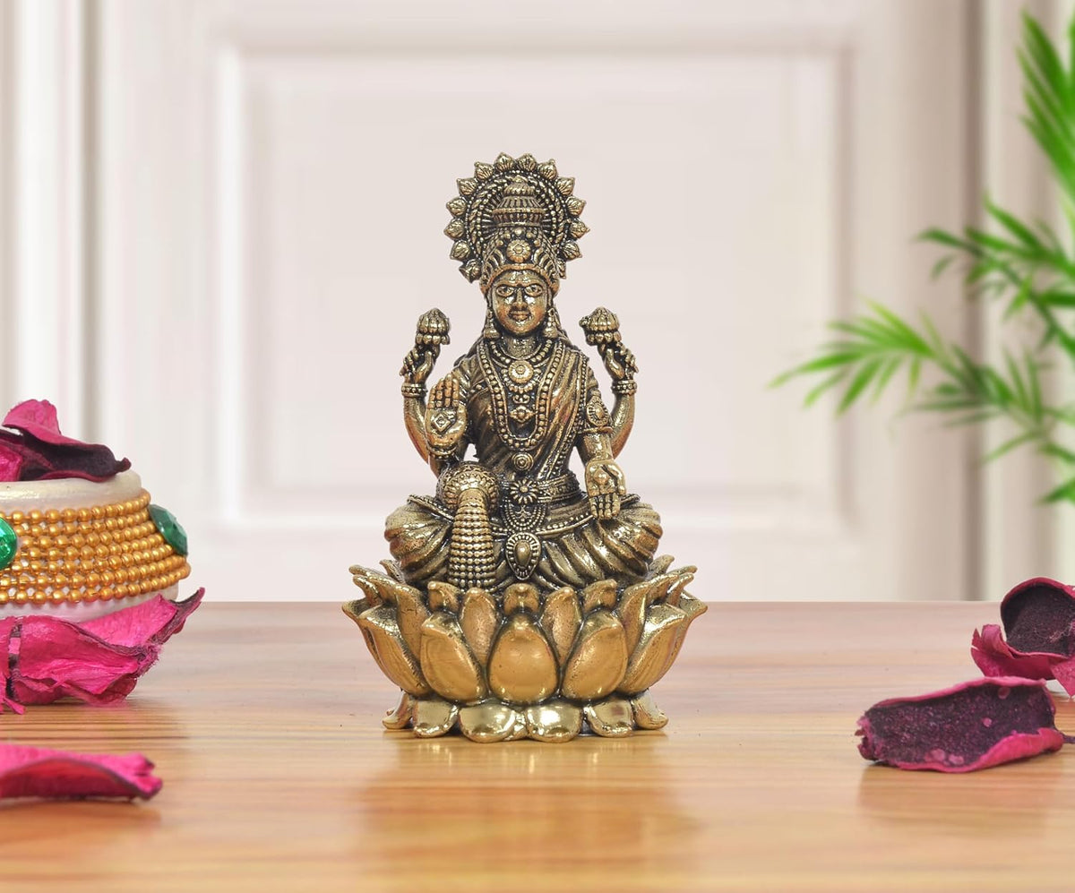 Lakshmi sitting statue in bronze tone on lotus base, detailed ornaments, 3 inch.