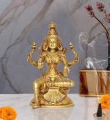 Brass Lakshmi statue, four arms, seated on lotus base for puja temple decor