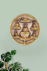 Round brass Buddha plate with six seated figures, central meditating statue for wall decor