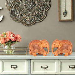 Small wooden elephant statue pair, carved details, tan, standing