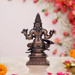 Maa Saraswati dark bronze figure with crown, multi-armed seated with veena