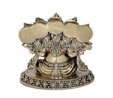 Back view of brass Panchmukhi Ganesha idol with flame-like crown and patterned base
