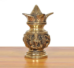 Brass kalash showpiece with carved Lakshmi & Ganesh details on body, gold finish