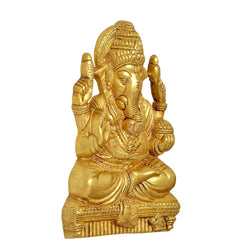 Brass Ganesha wall hanging idol side view, seated with hands raised in blessing