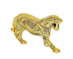 Golden metal tiger statue figurine, profile view showing muscular legs and tail
