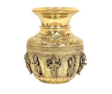 Close-up of brass kalash showpiece top with engraved leaf band and deity figures