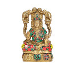 Gaja Lakshmi brass idol front view, ornate crown and multicolor gem inlay.